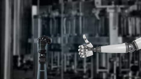 robot hands and blurred industrial background