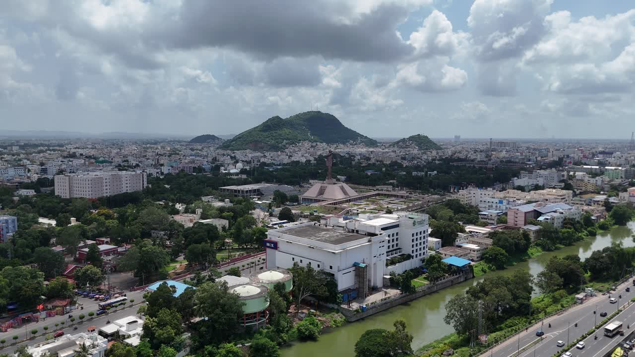 Aerial footage of the 125-foot Bhimrao Ramji Ambedkar statue in Vijayawada, Andhra Pradesh, India. This Ambedkar statue is 125 feet (38 m) tall and stands on an 81-foot tall foundation building.