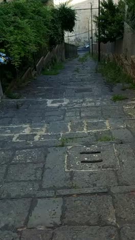 exploring a narrow alley in naples, italy