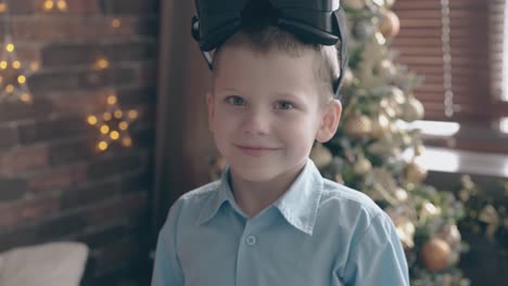 school child adjusts vr glasses and smiles wide to camera