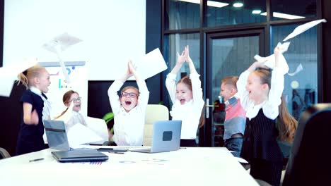 businessmens tossing documents in the air at the business meeting. business children