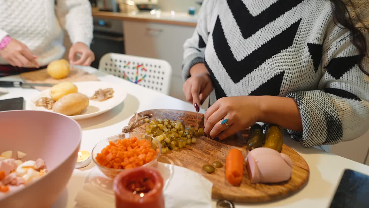 People preparing food in the kitchen