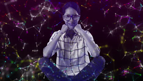 animation of portrait of smiling woman over colourful networks of connections