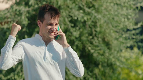 man gets water poured on head while on phone