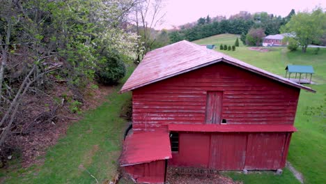 aerial-slow-push-into-red-barn-on-farm-near-boone-nc