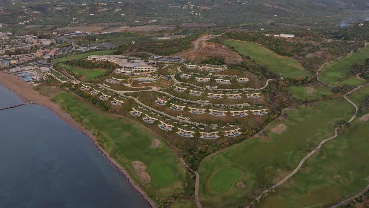Aerial view of drone flying over scenic resort and golf landscape