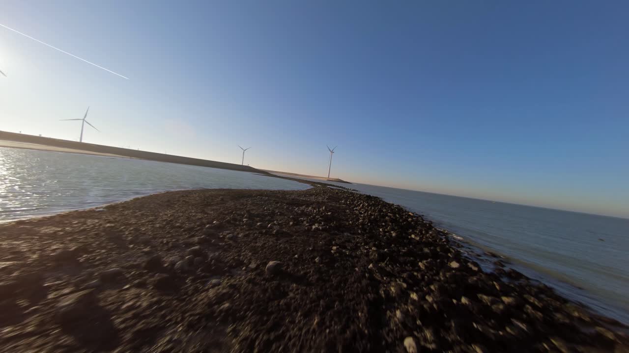 Low tide revealing a sandbar with rocks on the island Neeltje Jans