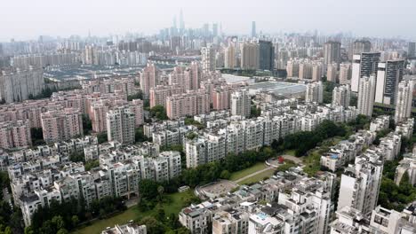 shanghai cityscape, rising aerial view over china urban city tower blocks