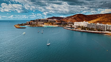 stunning aerial view of gran canaria coastline with boats and mountains