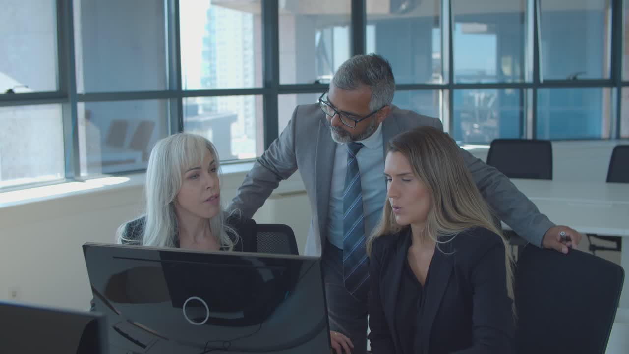 Female managers explaining project details to male boss