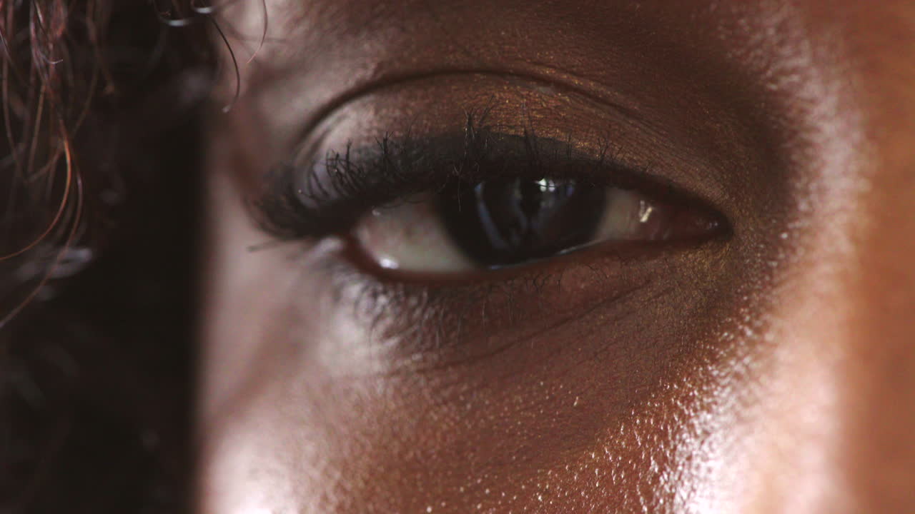 Closeup of the eye of a woman with an intense