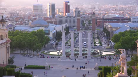 downtown barcelona spain is seen from the steps of the national palace