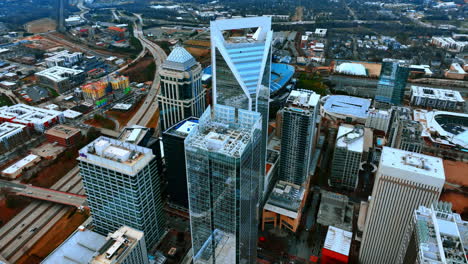 group of skyscrapers and highway system of metropolis at daytime. top view of charlotte, nc, usa