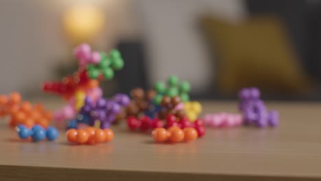 coloured interlocking shape puzzles on table at home for child diagnosed with asd 9