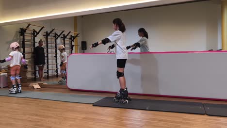 children learning to roller skate