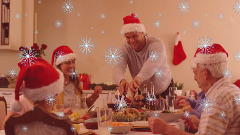 animation of snow falling over happy caucasian family during dinner at christmas