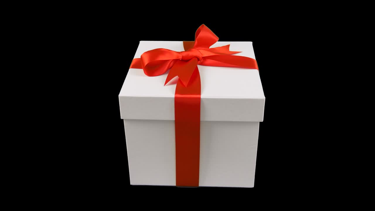 은 리본을 가진 색 선물 상자, 투명한 배경에서 회전, 알파 채널 크로마 키, 투명 한 배경, 텍스트를위한 빈 공간, 선물 상자의 위에 날아.