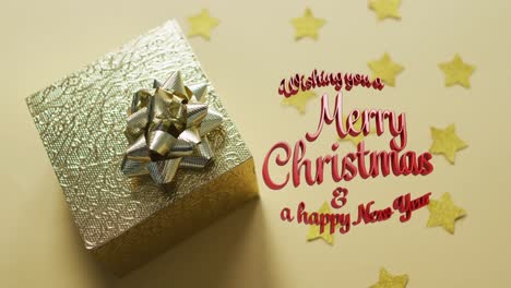 Animation-of-merry-christmas-text-over-present