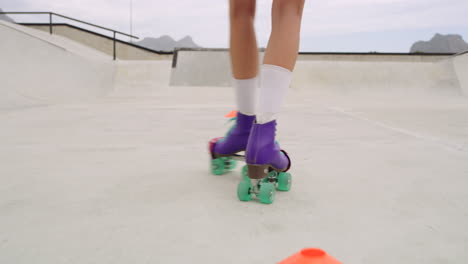 closeup of female legs roller skating outside