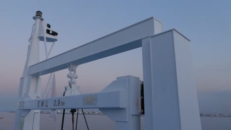 view of the crane on the ferry, equipment of the transport ship, steel cables