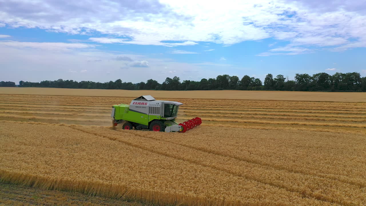 Combine harvester in action on the field. Combine harvester. Harvesting machine for harvesting a wheat field.