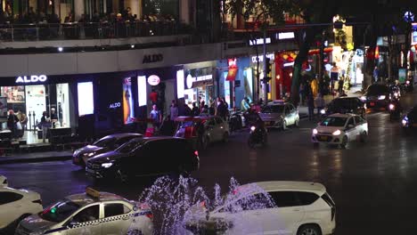 vehicles moving through a busy city intersection