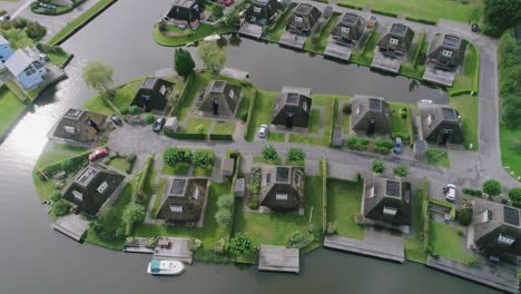 aerial topview of dutch holiday park during summer with nicely symmetrical aligned houses