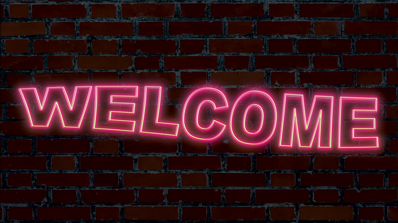 буквы в светящихся неоновых огнях, показывающие текст приветствия, движущиеся перед кирпичной стеной