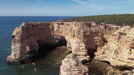 Flying-over-Praia-Da-Marinha--in-Algarve,-Portugal