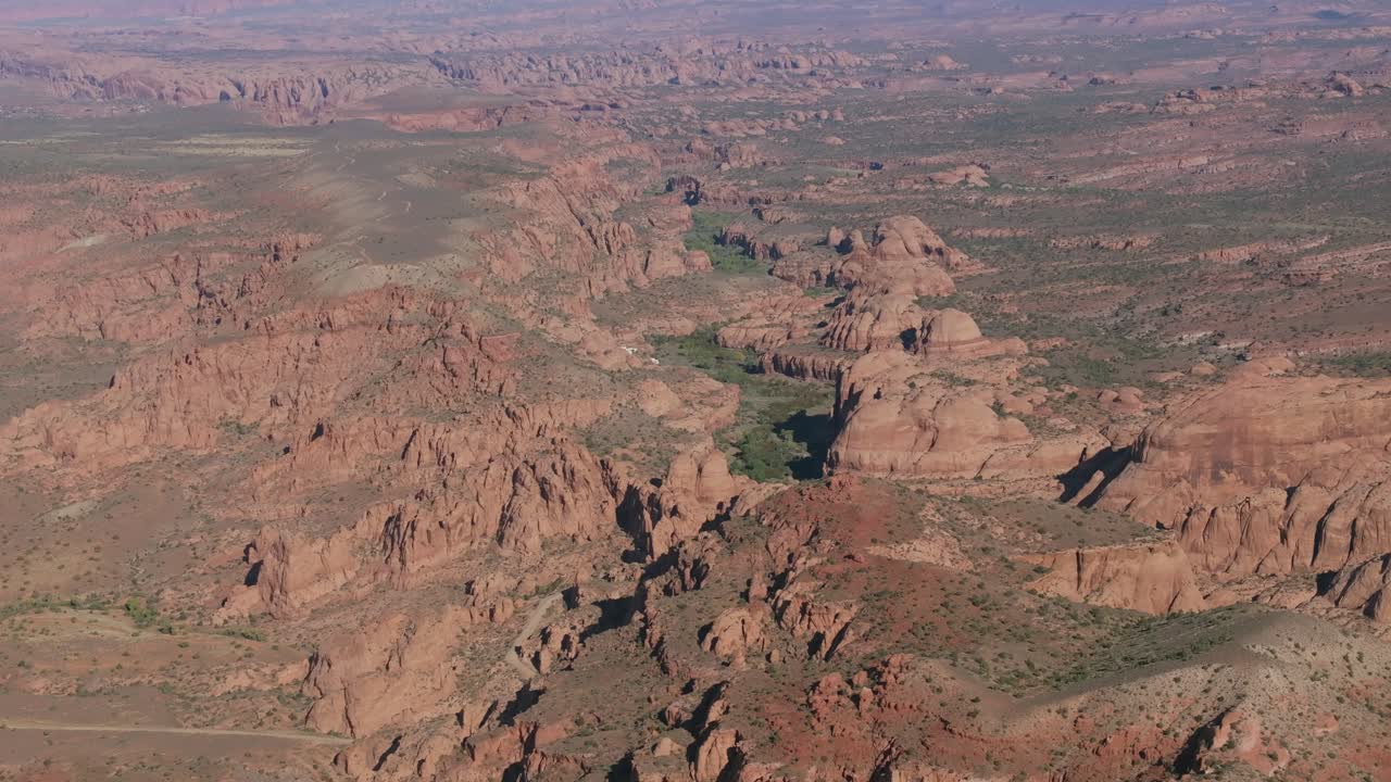 Aerial view of Moab's striking canyon landscape on a sunny day