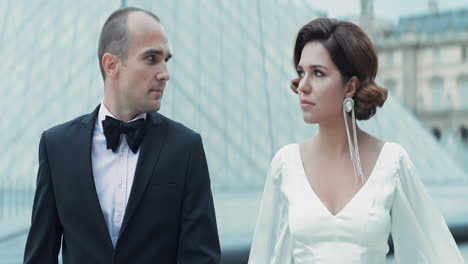 couple in formal wear at the louvre museum