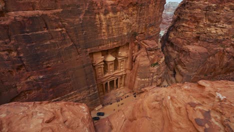 the treasury at petra, historic unesco heritage site carved into sandstone in jordan seen from a scenic viewpoint above and sideways. famous indiana jones hollywood movie filming location and tourist destination khaznet.