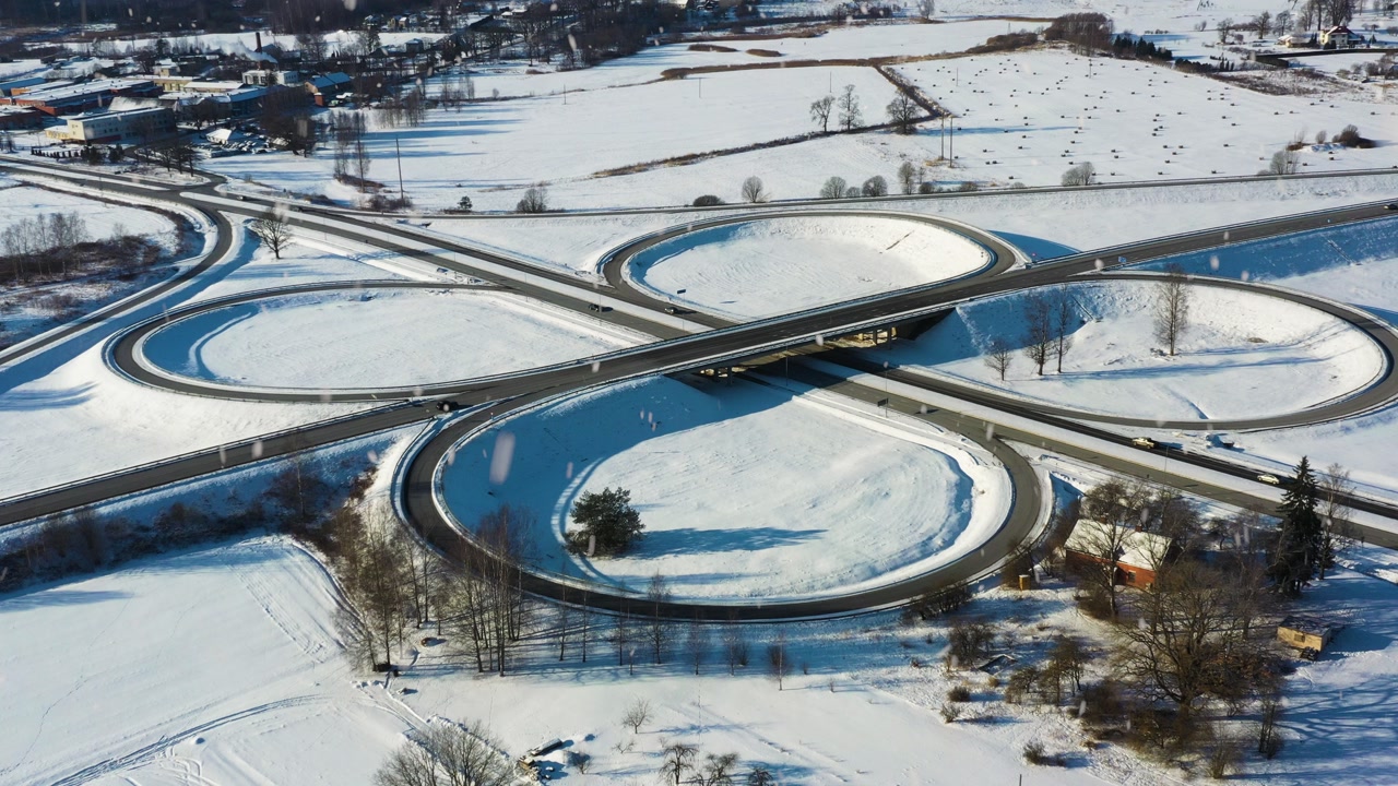 Cloverleaf interchange highway connecting roads, facilitating winter transportation logistics