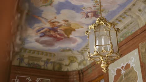 Details-of-a-fancy-Wedding-Location-with-ceiling-Painting-and-a-gold-chandelier