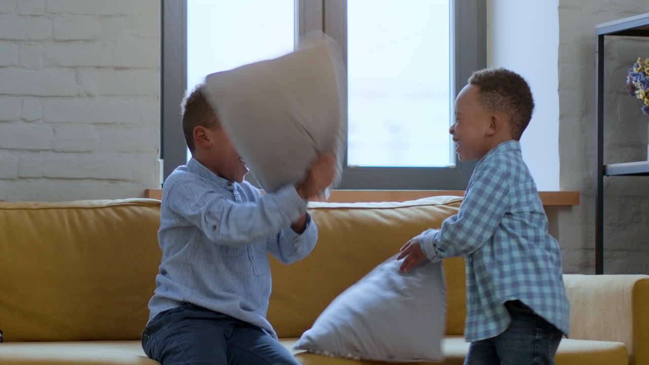 Two Boys Having a Pillow Fight