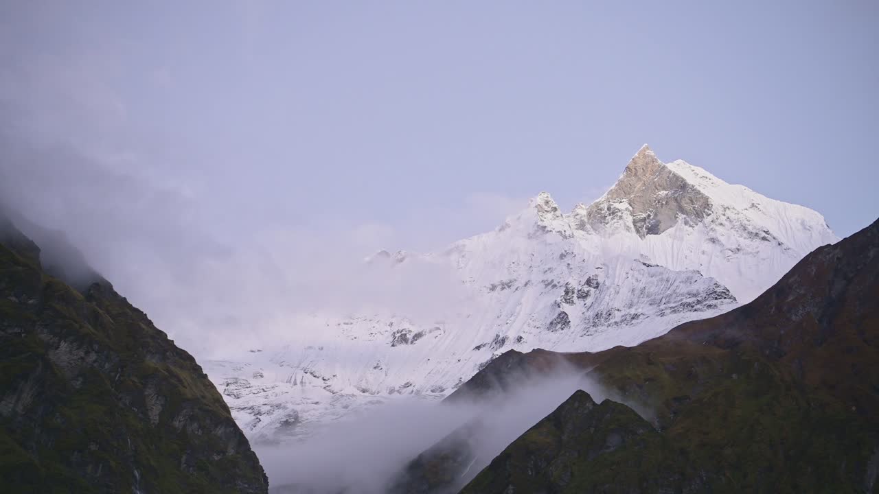 Snowy Himalayas Mountains Background with Copy Space, Snow Covered Winter Mountain Summit Background with Copyspace for Text, Dramatic Mountain Scenery with Mist and Clouds