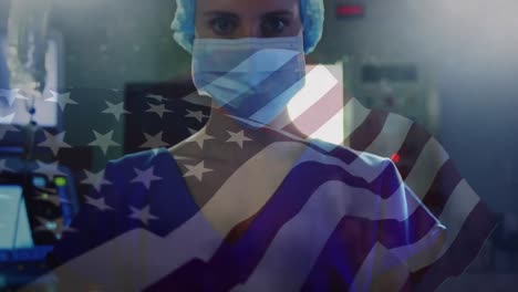 Animation-of-waving-usa-flag-over-portrait-of-caucasian-female-surgeon-in-surgical-mask-at-hospital