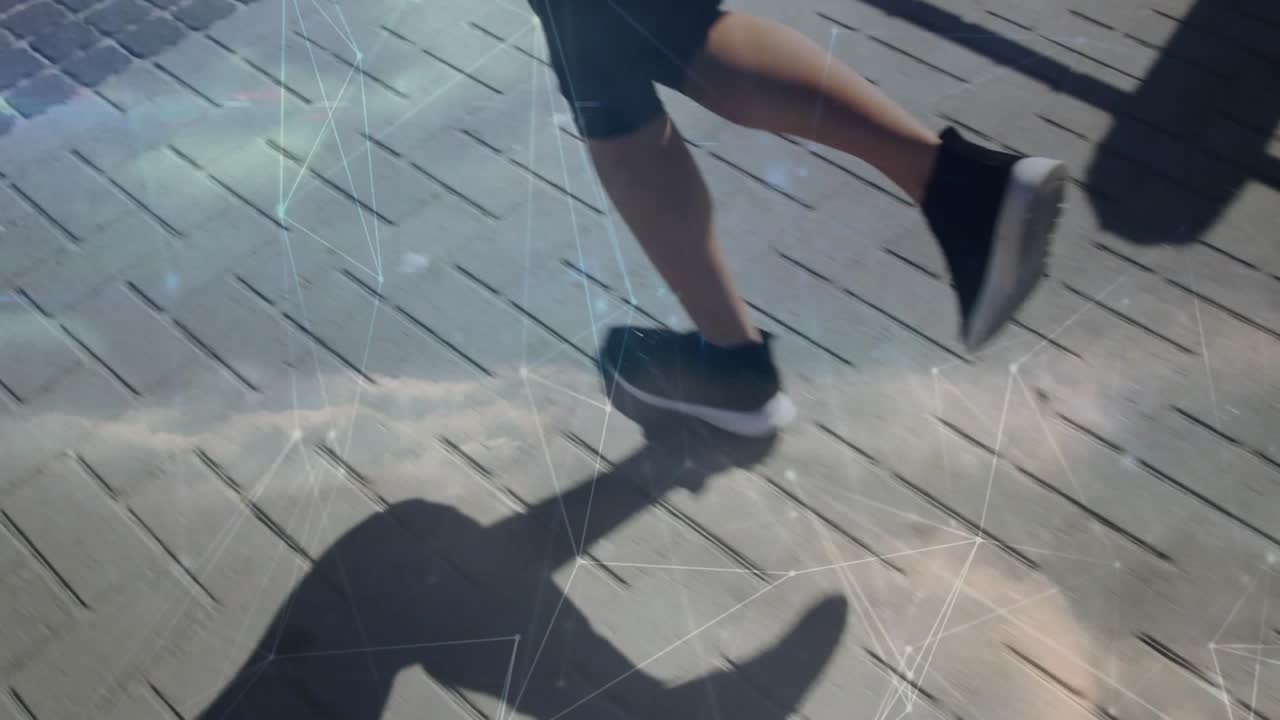 Opening foot contact initiating two runners matching pace across wooden deck, casting long shadows