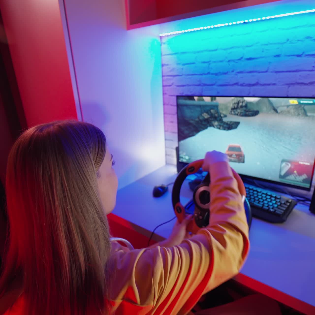 . Woman driving simulator. Young girl playing racing computer game