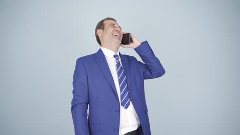 businessman happily speaking to camera.