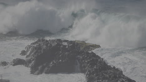powerful waves crashing on rocky coast