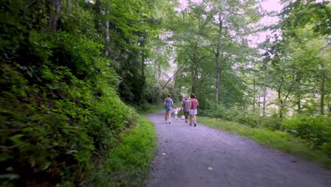 family walking around trout lake in blowing rock nc