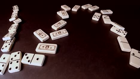 dollar dominoes chain reaction symbolic of recession economy and falling stock prices in a bear market business climate