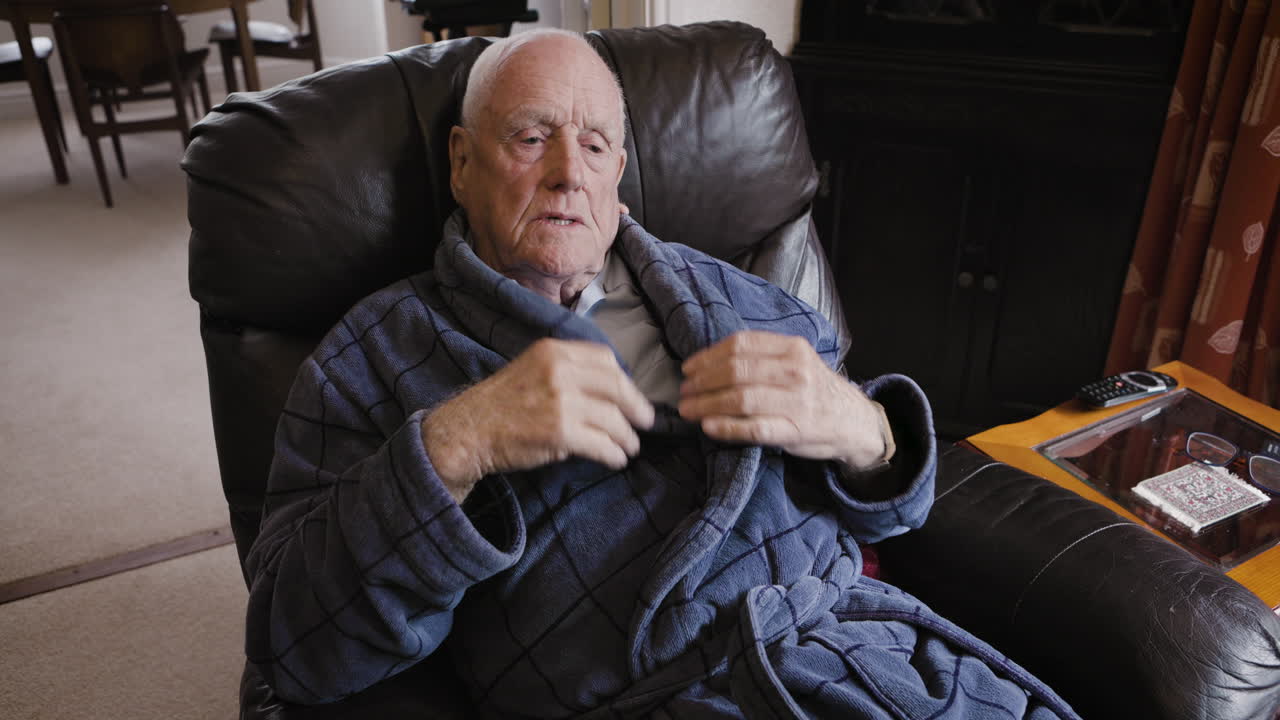 Elderly man sleeping in a chair