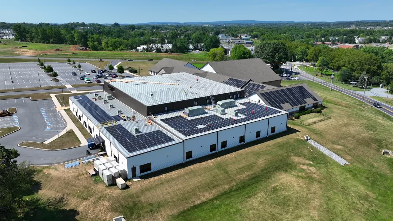 Solar panels being installed on industrial roof