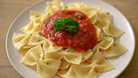 farfalle pasta in tomato sauce with parsley - italian food style