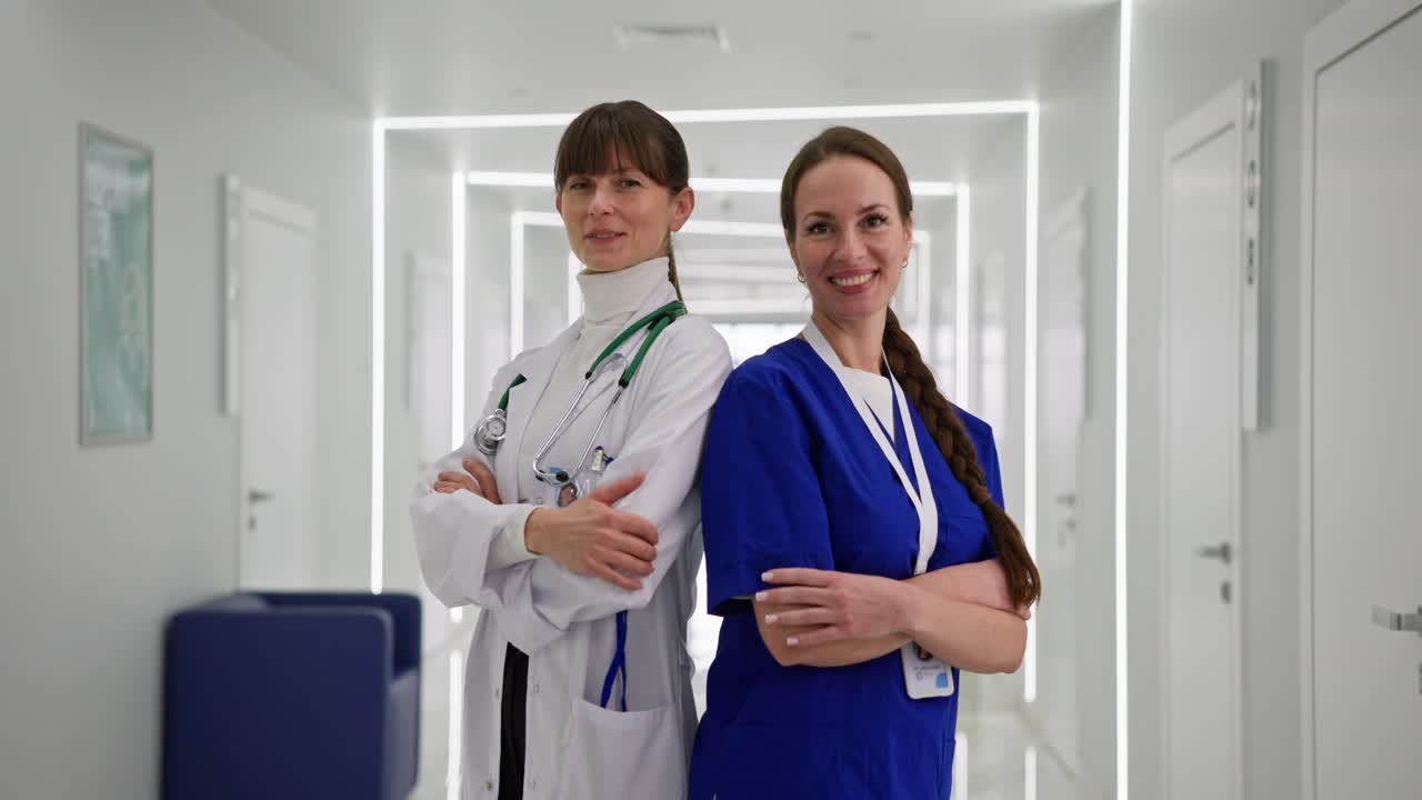 Two Doctors Standing in Hospital Corridor