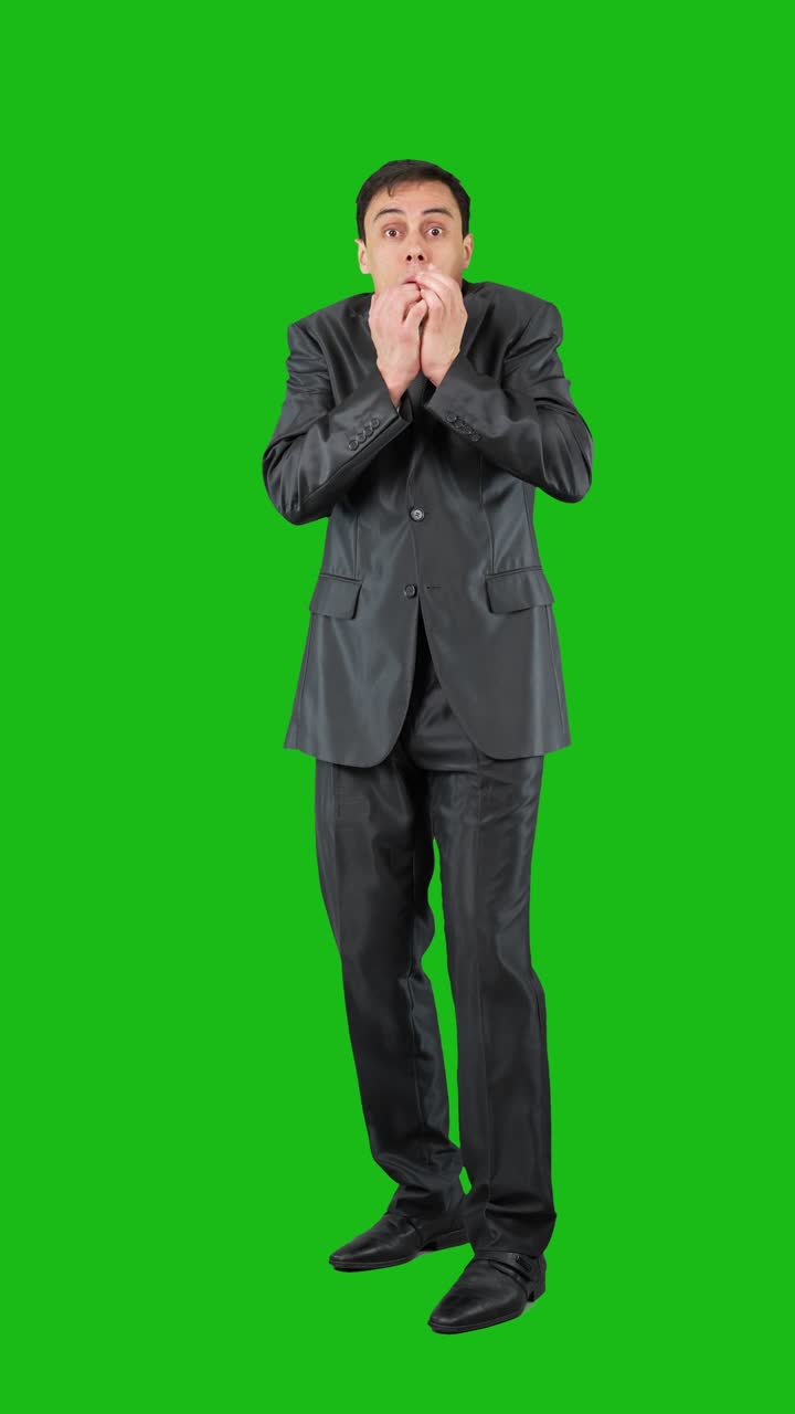 Businessman Hiding Face and Showing Distress on Green Screen
