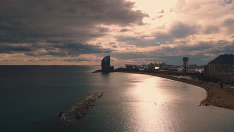 Barceloneta-Beach-in-Barcelona-with-colourful-sky-at-sunset