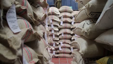 dolly-forward-into-a-warehouse-full-of-coffee-sacks